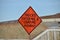 Orange highway construction warning sign