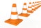 Orange highway traffic construction cones with white stripes isolated