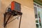 Orange homemade air conditioner with a large radiator and compressor on the wall of a house in the village of Esilova, Turkey.