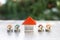 Orange houses and houses on the coin pile Planning ideas for real estate investing, saving and buying homes, mortgages