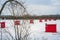 Orange Ice Fishing cabins in a vast spaces on the frozen river