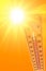 Orange illustration representing the hot summer sun and the environmental thermometer that marks a temperature of 45 degrees