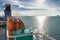 Orange inflatable lifeboats on ferry deck for emergencies and maritime accidents. Rescue boat, raft on the roof of a ferry.  Life