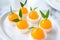 Orange jellies are decorated on a plate of orange-like characteristics. Has a sweet and sour taste
