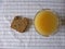 Orange juice and bread on plaid textile tablecloth