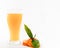 Orange juice in glass with pieces of oranges and green leafs on black background. Summer and freshness concept.Copy Space