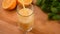 Orange juice in glass on wooden table