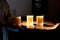 Orange juice in glasses being served on tray backlit by sun in Marrakech Morocco