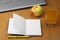 Orange juice,laptop,apple notepad and pen
