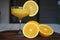 Orange juice in a stemmed glass with sliced ??oranges