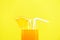 Orange juice summer glass with piece orange fruit with yellow