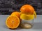 Orange juicer with ripe oranges. Fresh juice.