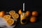 Orange, juicy fruits isolated on black background. Fresh juice.