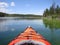 Orange kayak floats on British Columbia lake