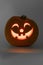 Orange kind smiling illuminated Halloween pumpkin