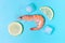 Orange king prawn and ice on blue background top view