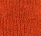 Orange knitted scarf texture