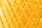 Orange knitting thread texture, handiwork backdrop