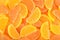 Orange and lemon candy slices as background