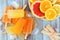 Orange, lemon and grapefruit ice pops, overhead scene on wood