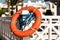 orange life buoy, safety near swimming pool, lifesaver, blue ropes