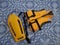 An orange life jacket and an orange plastic rescue torpedo buoy for lifeguard on the pool floor. Compliance with safety