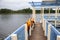 Orange life jackets and fishing equipment on the fishing bridge. The concept of safety behavior on the water, accident, drowning