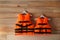 Orange life jackets on wooden background. Personal flotation device