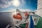 Orange lifeboats and decks aboard a cruise liner