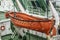 Orange lifeboats on the ship\'s davits