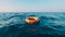An orange lifebuoy floating at sea, Ai Generated