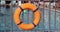 Orange lifebuoy hanging near swimming pool 4k movie slow motion