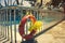 Orange lifebuoy near the open children`s pool