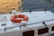 Orange lifebuoy on the roof of an old  boat