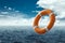 Orange Lifebuoy on the water. The concept of help, rescue, drowning, storm. Copy space