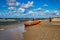 An orange lifeguard boat on a beach in Åeba in Poland on a warm  day