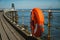 Orange lifeguard ring on a pier