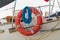 Orange lifeline ring on a boat. Lifebuoy ring