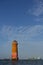 Orange Lighthouse in the middle of the sea of Sunda Kelapa