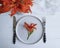 Orange lily flowers plate fork knife catering elegant design template a wooden background textiles