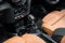 Orange luxury car Interior with steering wheel, shift lever and