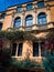 Orange luxury mansion with blue sky reflection arch windows