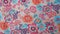 Orange and magenta floral fabric pattern