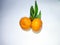 the orange mandarin as we know santang orange or shantang isolated on white, fresh and sweet mandarin orange with leaves,