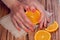 Orange manicure and oranges