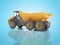 Orange mining dump truck isolated rear view 3D render on blue background with shadow