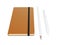 Orange moleskine or notebook with pen and pencil and a black strap front or top view isolated on a white background 3d rendering