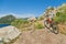 Orange mountain bike at cliff overviewing sea