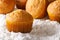 Orange muffins closeup in powdered sugar. horizontal