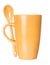 Orange mug with spoon empty blank for coffee or tea